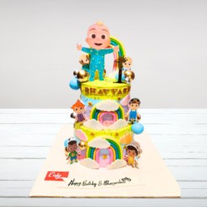 "Cocomelon 3 Tier Kids First Birthday Cake featuring vibrant Cocomelon decorations across three tiers, perfect for a grand and joyful first birthday celebration."