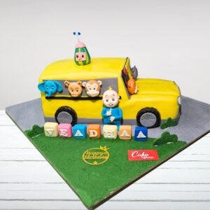 "Cocomelon Bus Shape Designer Kids Birthday Cake 4 Kg with vibrant Cocomelon bus design, perfect for a fun and unique birthday celebration."