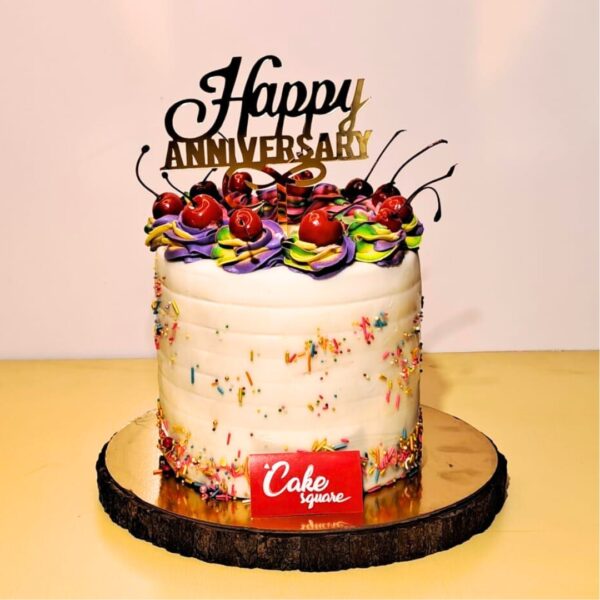 "Rainbow Cake 2 Kg Anniversary Cake, featuring vibrant layers and a colorful design ideal for a joyful celebration."