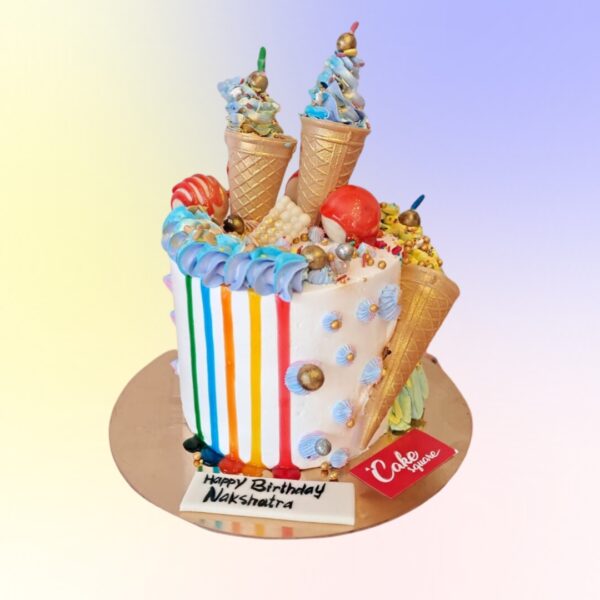 Rainbow colured two tier Birthday cakes for children in mango flavour is Candy and ice cream cones Birthday cakes 3 Kg made by Cake Square Team