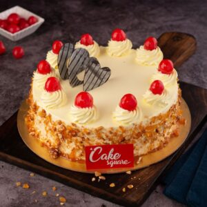 A perfect butterscotch nuts filled inside andgarnished outside with swirl pipings with whipped cream topped with red cherries is our Classic Butterscotch 1 kg Birthday Cake. Made by Cake Square Team