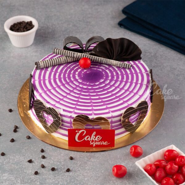 A colourful swirl decorated creamy Driping Black currant Vanilla 500 gms eggless Birthday cake by cake square