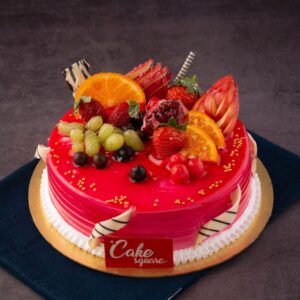 A combination of blueberry and mango flavour on a moist vanilla sponge and topped with loads of fresh fruits cut elegantly is our Fresh Fruit Blueberry Mango 1 kg Birthday Cake made by Cake Square