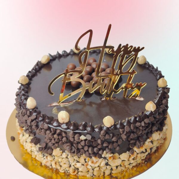Beautiful Chcolate cake filled with rich hazelnut and adorned with beautiful Birthday cake topper by cake squre