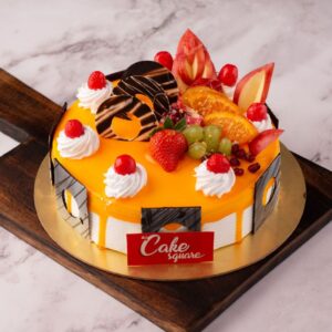 Yellow colour cake decorated with fresh fruits and chocolate ganache for more tastiness is our Juicy Mango Half Kg Birthday Cake . Made by Cake Square Team