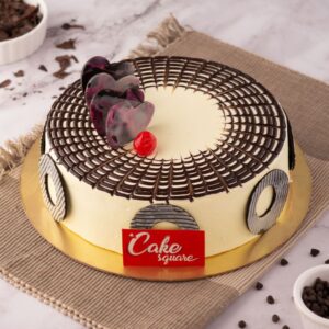 A touch of chocolate on top of the Stylish Butter scotch 500 gms Birthday Cake with swirl piping and with red cherries to top up we got our Cake. Made by Cake Square Team.