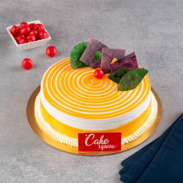 A Yellow 1 Kg cake made win vanilla sponge and mango fillings of right amount and swirl design on top is our Swirly Mango 1 Kg Birthday Cake. Made by Cake Square Team