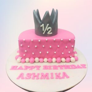 "6 Month Birthday Cake in Pink with adorable pink decorations, perfect for a baby’s half-birthday celebration."