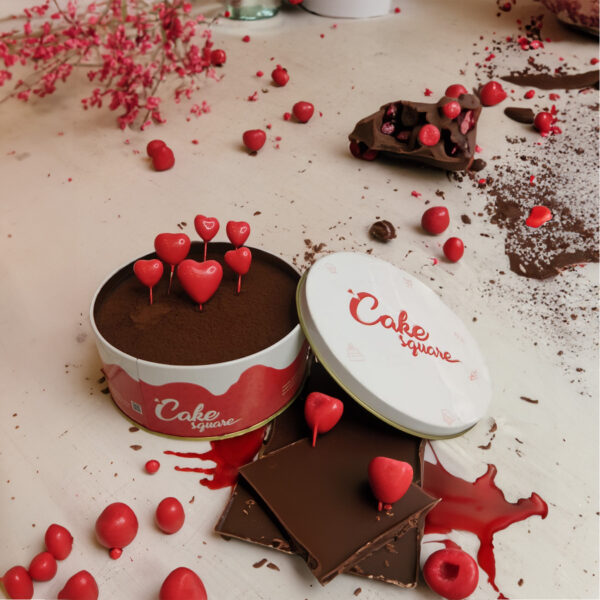 "1 kg heart-themed surprise cake with multiple heart decorations and dreamy design"