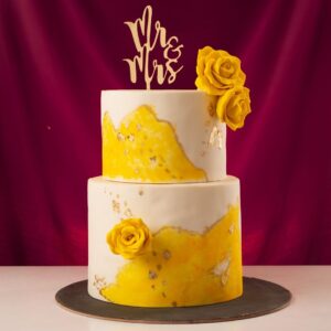 Radiant Amazing yellow 5 kg wedding cake with multiple tiers, featuring ombre yellow frosting, intricate lace patterns, and delicate sugar flowers, crafted by Cake Square Chennai.