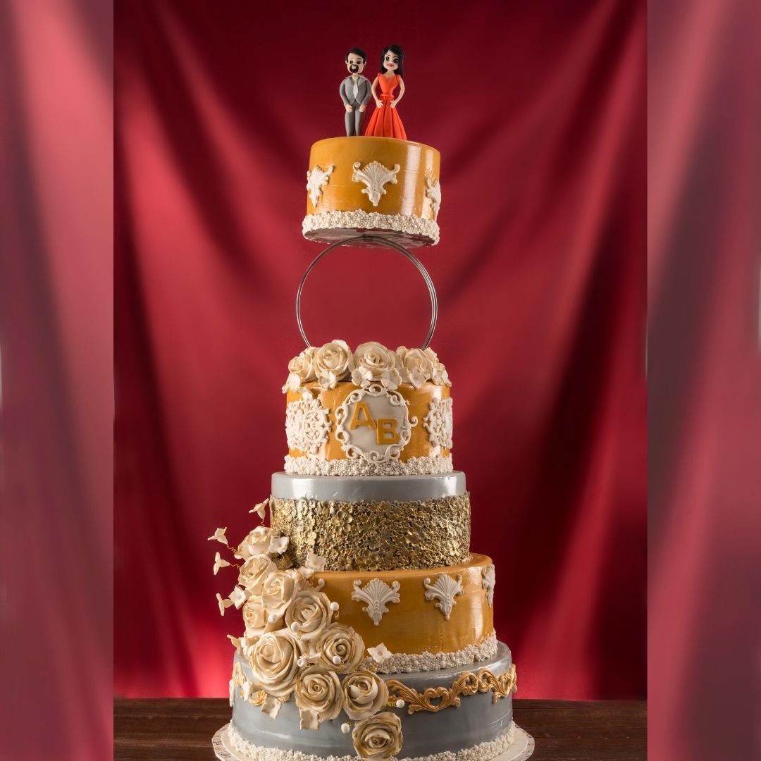 Impressive Big Wedding/Engagement Cake featuring multiple ornate tiers, intricate designs, and a grand silhouette, created by Cake Square Chennai to serve a large celebration.