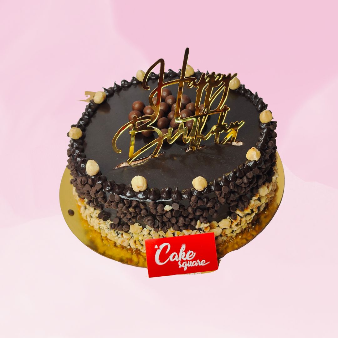 1 kg chocolate birthday cake with hazelnut flavoring and nut decorations.Made by Cake Square Team.