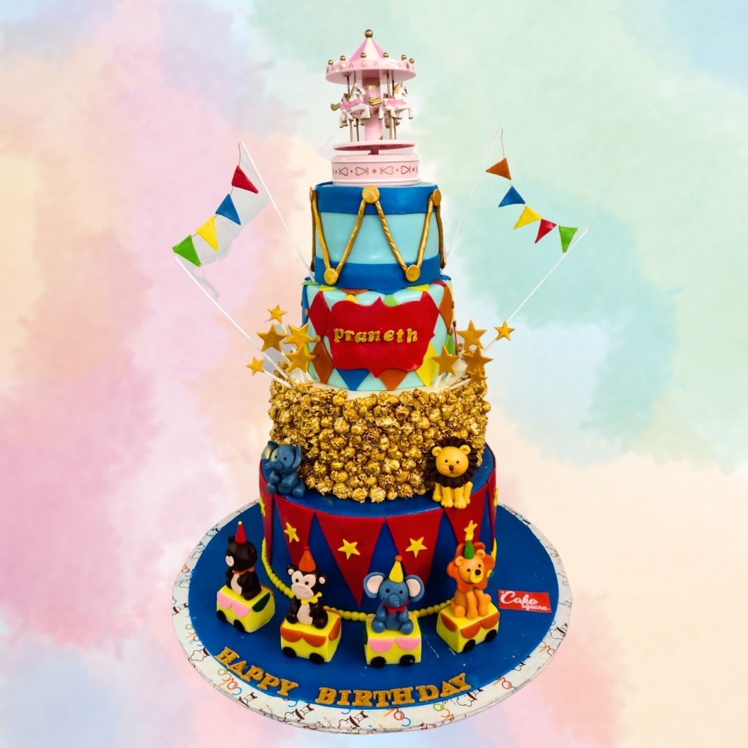 "Circus Theme 4-Tier First Birthday Cake with vibrant and colorful circus decorations, perfect for a grand and entertaining first birthday celebration."