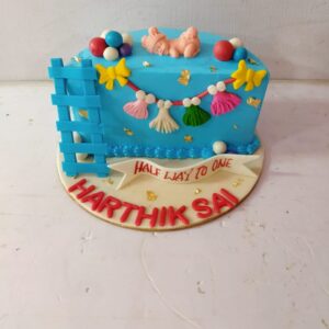 "1 kg baby-themed half birthday cake with pastel colors and '6 months' decoration"