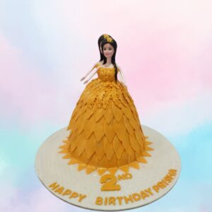 "Golden Barbie Girls Birthday Cake 2 Kg featuring a glamorous Barbie design in gold, perfect for a stylish girl's birthday celebration."