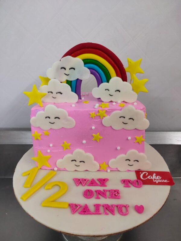 "Half Birthday Cake Cloud Theme 1 Kg featuring soft cloud decorations, perfect for a dreamy half-birthday celebration."