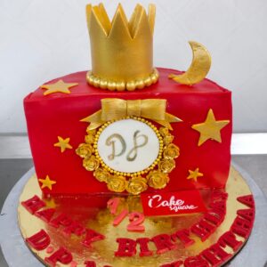 "1 kg half birthday cake with gold crown theme and '1/2' decoration"