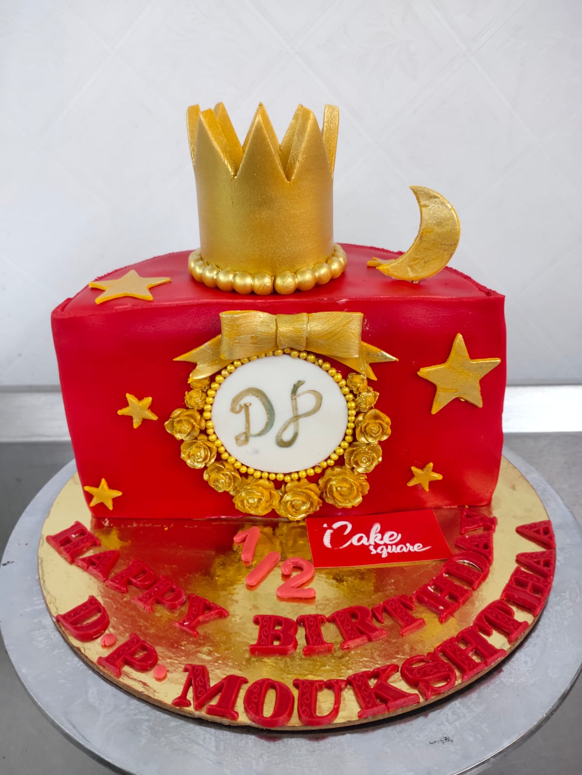 "1 kg half birthday cake with gold crown theme and '1/2' decoration"