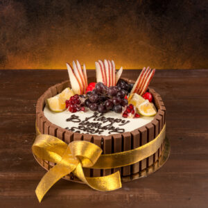 1 kg birthday cake with KitKat chocolate bars and fresh fruit toppings.Made by Cake Square Team.