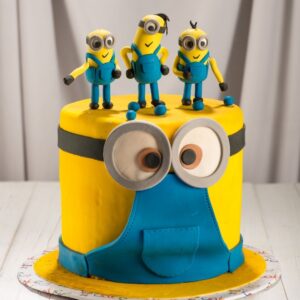 "Minion Theme Kids Birthday Cake 2 Kg featuring adorable Minion characters, perfect for a fun and playful kids’ birthday celebration."