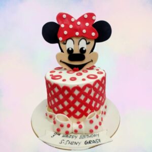 "Minnie Theme Girls Birthday Cake 1 Kg with adorable Minnie Mouse designs, perfect for a Disney-themed girls' birthday party."