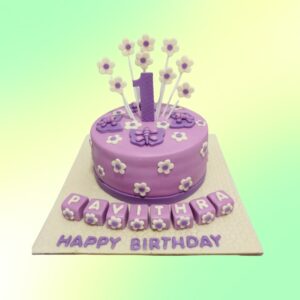 "Purple Flower Girls Birthday Cake 1 Kg featuring delicate purple flower designs, perfect for a small and elegant girls' birthday party."