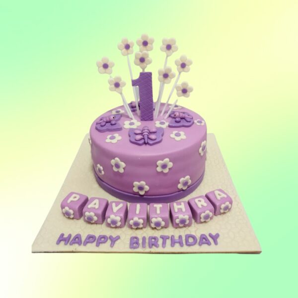 "Purple Flower Girls Birthday Cake 1 Kg featuring delicate purple flower designs, perfect for a small and elegant girls' birthday party."