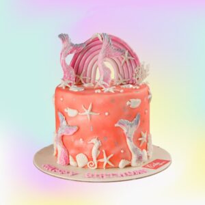 Rainbow Mermaid Peach Theme Birthday Cake 2 Kg with peach-colored frosting and undersea decorations.