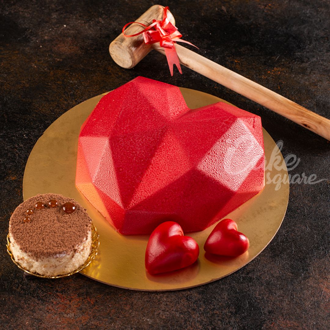 Vibrant red heart-shaped pinata cake filled with candy surprises Red Heart Shape 500gms Pinata Cakes