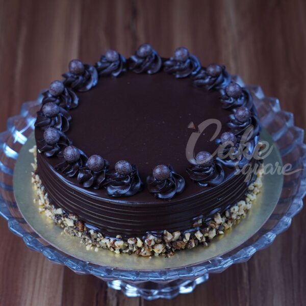 1 kg anniversary cake with rich chocolate and hazelnut flavors.Made by Cake Square Team.