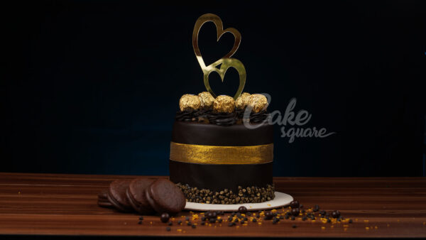 1 kg anniversary cake with rich Ferrero Rocher chocolate flavor and decorations.Made by Cake Square Team