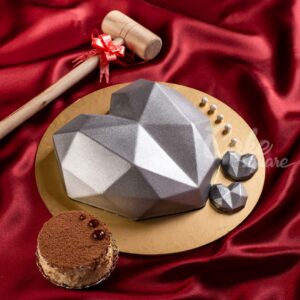 Elegant silver heart-shaped 1/2 kg pinata cake with hidden candy treasures