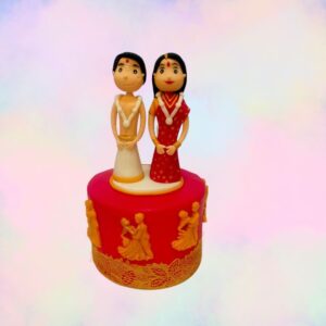 Charming Small Wedding Cake Of Indian Couple 2 Kg featuring traditional Indian designs, bright colors, and a cute Indian couple topper, meticulously crafted by Cake Square Chennai.