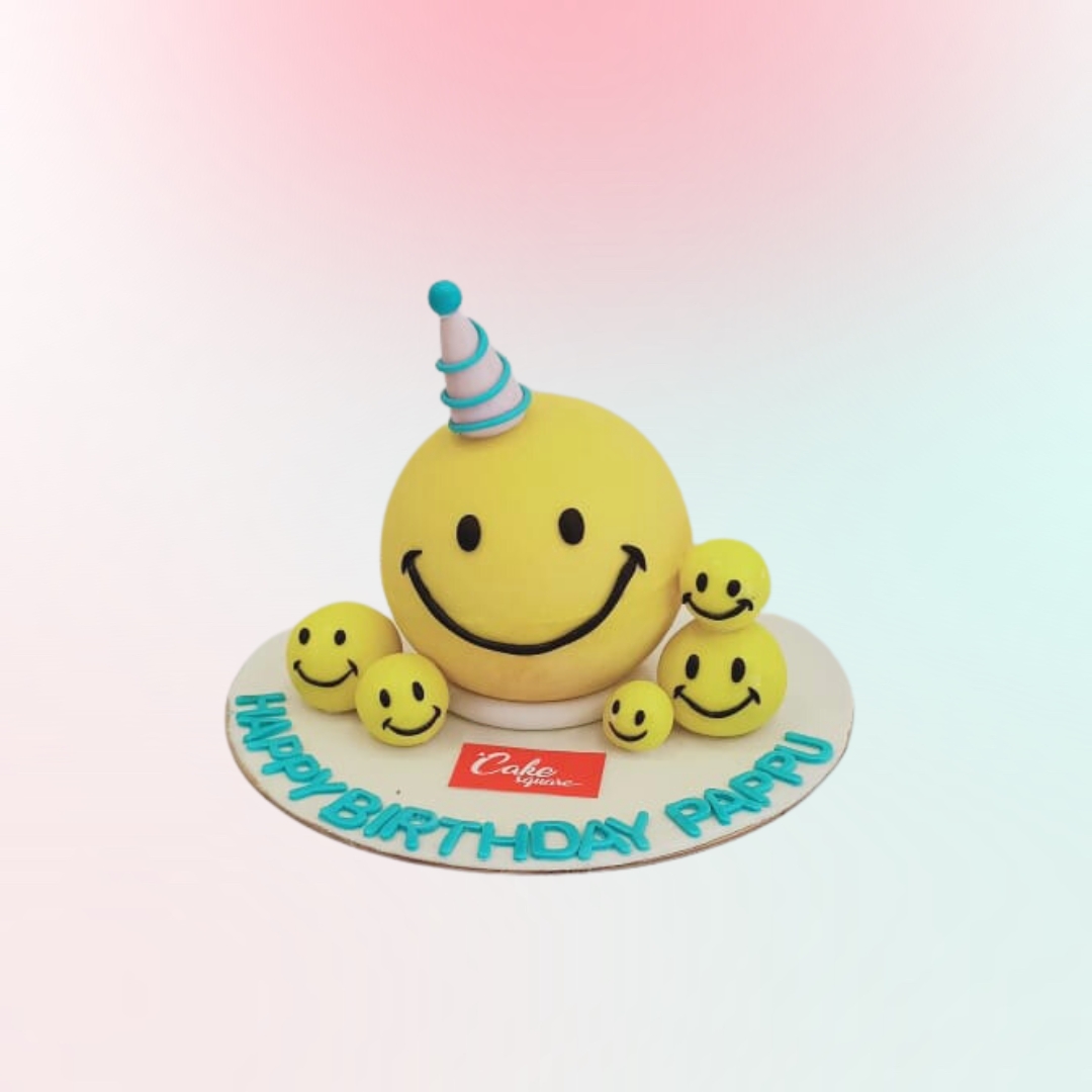 Smiley Theme Pinata Cake 1Kg featuring a bright yellow smiley face design filled with colorful candies and treats.