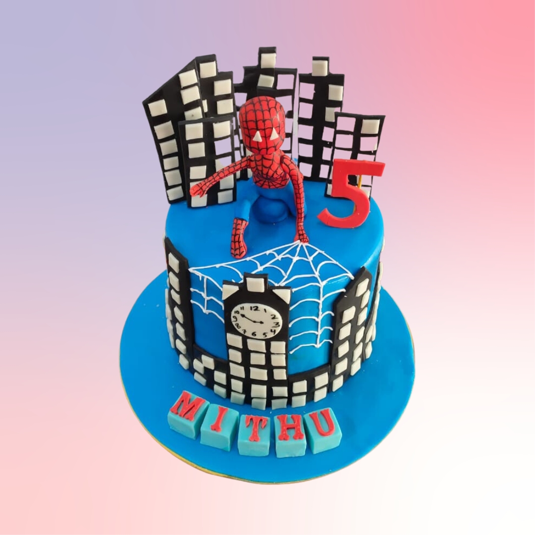 Spiderman 5th Birthday Cake for Boys with web designs and Spiderman figure, perfect for a superhero-themed celebration."