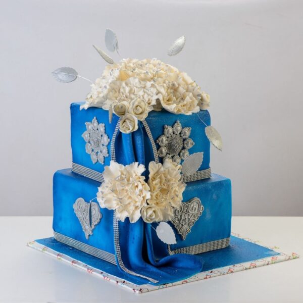 Modern Square Wedding cake in Blue 6 Kg with multiple square tiers in varying shades of blue, featuring clean lines, geometric patterns, and minimalist decorations, created by Cake Square Chennai.