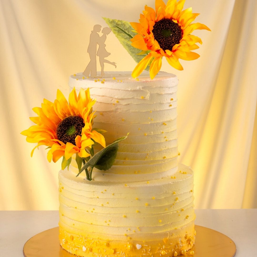 Cheerful Sunflower 4 Kg Wedding Cake with multiple tiers adorned with lifelike sugar sunflowers and green leaves, created by Cake Square Chennai.