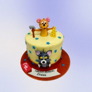 "Tom And Jerry Theme 1 Kg Kids Birthday Cake featuring playful designs of Tom and Jerry, perfect for a fun-filled birthday celebration."