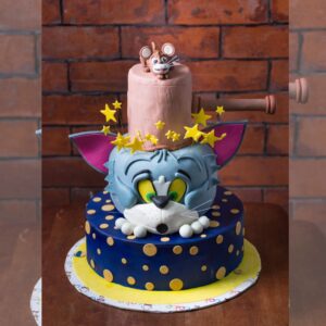 "Tom and Jerry Theme First Birthday Cake 5 Kg featuring fun and colorful Tom and Jerry characters, perfect for a playful and memorable first birthday celebration."