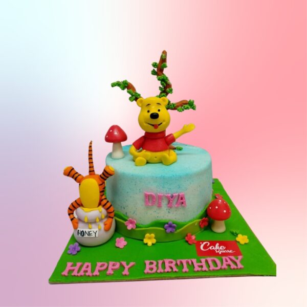 "Winnie The Pooh Kids Birthday Cake 2 Kg with charming designs of Pooh and friends, perfect for a fun-filled birthday celebration."