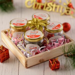 A set of 4 Jars for Gifting Christmas, beautifully packaged and filled with festive treats, ready to spread holiday cheer to your loved ones.