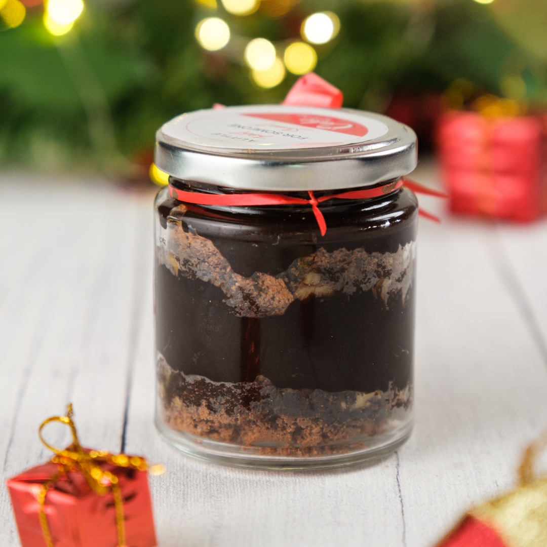 A jar of Best Chocolate Mousse in a Jar 240 gms, showcasing its rich and creamy texture, elegantly displayed on a dessert table, perfect for chocolate lovers.