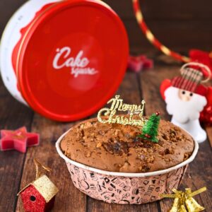 Buy Christmas Walnut Tea Cake 500 gms in tin elegantly presented in its festive tin, ready to enhance holiday celebrations with its delightful flavour and appearance.