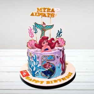 "Ocean-themed Creamy Mermaid Birthday Cake 1 Kg with mermaid tail and seashell decorations"