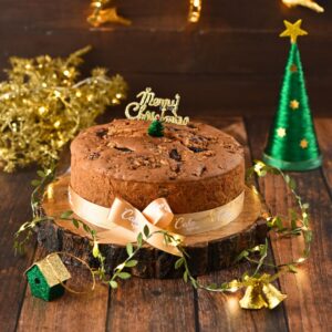 A Full of Walnut Cake 1 kg Christmas Cakes elegantly presented with rich texture and walnut pieces, perfect for holiday celebrations.