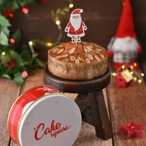 A Gift Tin with Almond Tea Cake 250 gms inside perfect to be served with a cup of tea during your Christmas feasts.