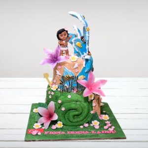 "Large multi-tiered Moana-themed cake with ocean waves, tropical islands, and character decorations"