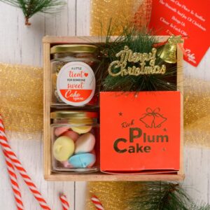 A Rich Plum Cake Happy Gift box @699 elegantly displayed, showcasing its festive packaging and delicious plum cake, ready to spread holiday cheer.