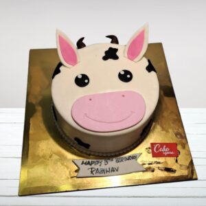 Playful 1 Kg Cow Theme Birthday Cake decorated with a smiling cow face and farm-inspired accents