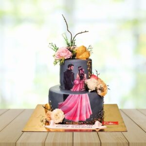 Whimsical wedding cake featuring a charming fondant bride and groom figurine, surrounded by delicate floral accents in this Cute Couples Wedding Cake 4 Kg.